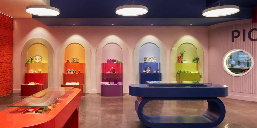 Okay Dispensary Circular pendant lights and recessed downlights highlight items for sale inside a dispensary