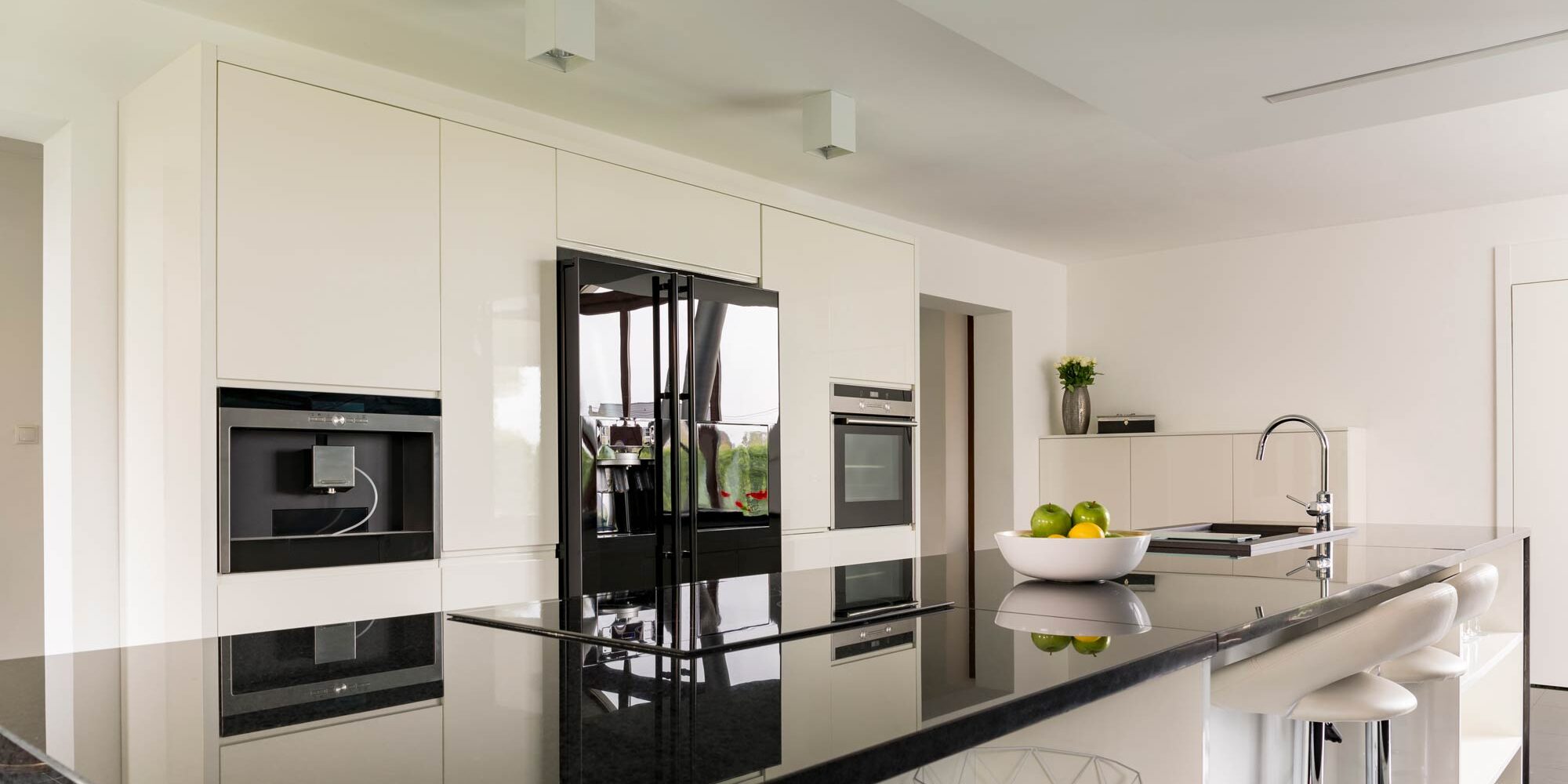 Residential Lighting Square flush-mount downlights installed in a modern home kitchen