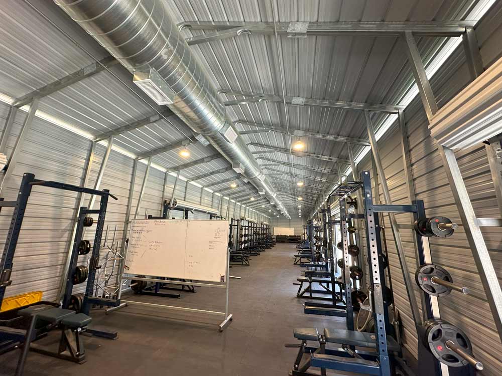 Sierra Canyon School LED low bay lighting inside a high school weight room