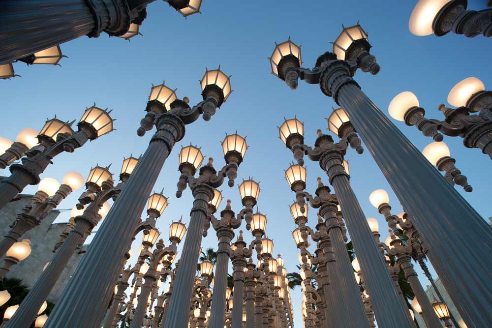 Classic city streetlamps are arranged to form a public art installation