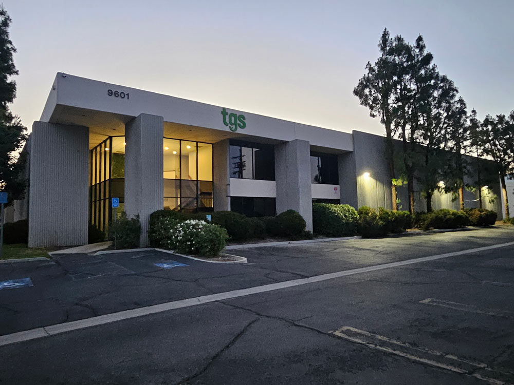 A photo of the TGS office building at sunset